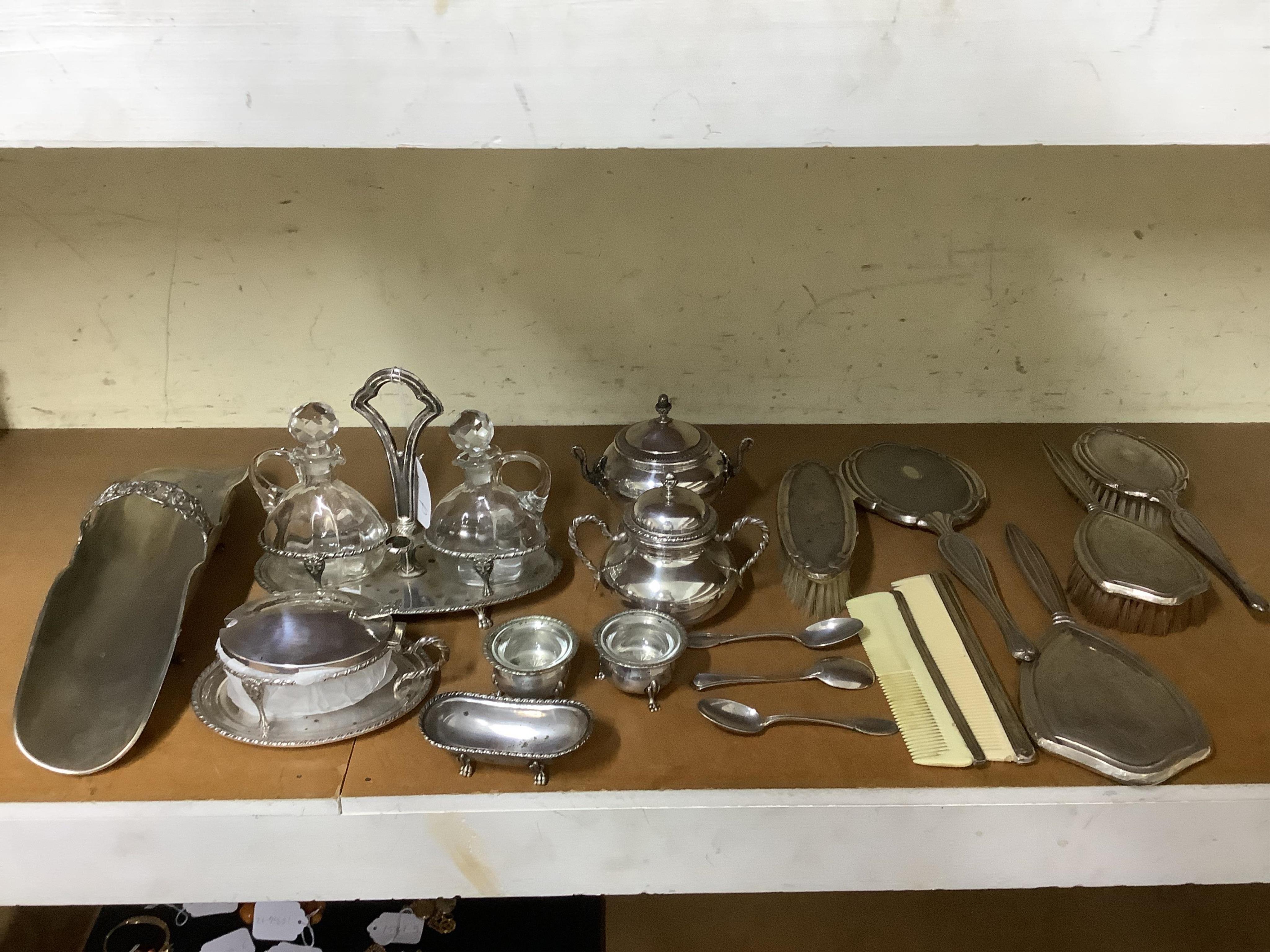 A group of 20th century Italian 800 standard white metal table wares, to include an oil and vinegar bottle holder, two sugar bowls and covers, 409g, a mustard pot with glass liner, three silver salts and a bread stand, 3